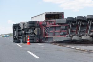 An overloaded and fast truck overturned on road in Austin.