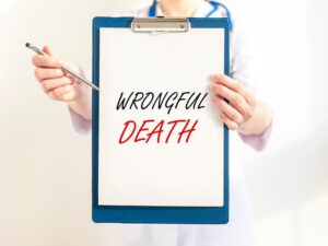 Medical professional holds clipboard with "WRONGFUL DEATH" text, emphasizing the gravity of legal medical claims.