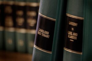 Close-up of legal books on a shelf, focusing on "Landlord and Tenant" title.