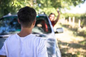 The angry man shouts at a man by in the car