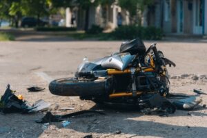 motorcycle lying on the road after a collision