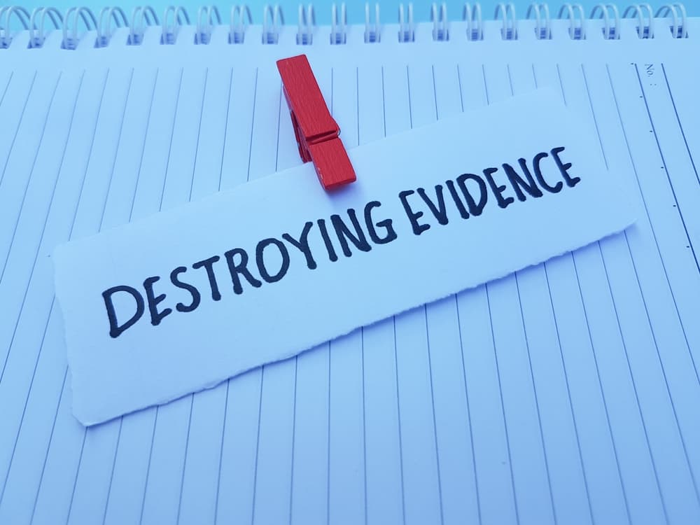 Destroying evidence written on paper background