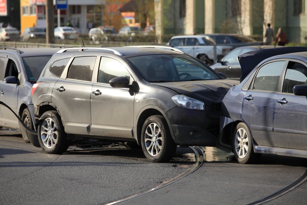 Collision of three cars at a crosswalk