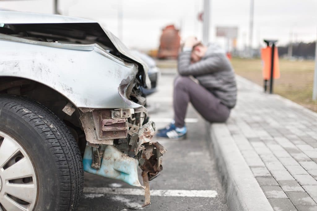 a man upset after being involved in an Austin area car accident